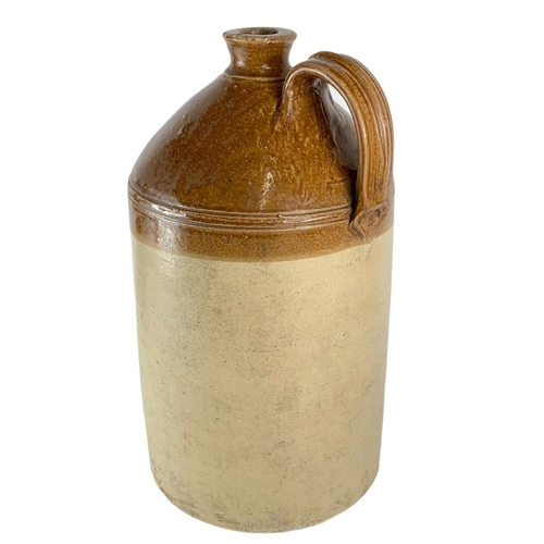 105 - Large early 20th century stone jar with with handle. 50cm