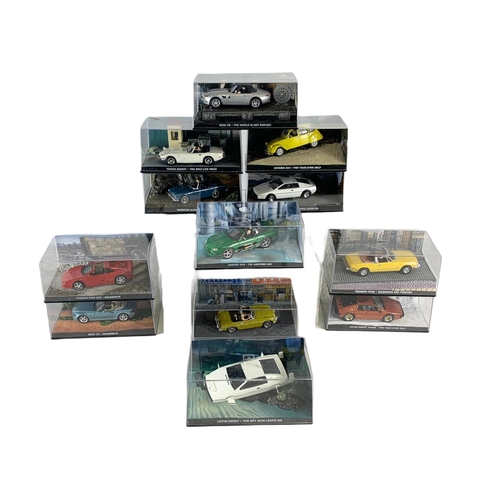 128 - Quantity of 007 James Bond model cars in cases. 14cm