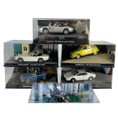 128 - Quantity of 007 James Bond model cars in cases. 14cm