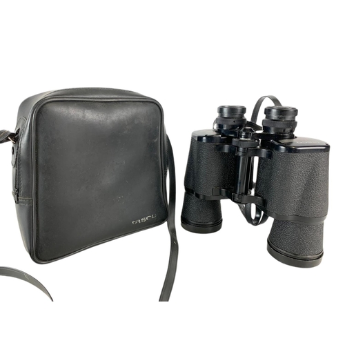 143 - Tasco binoculars in case. 20cm