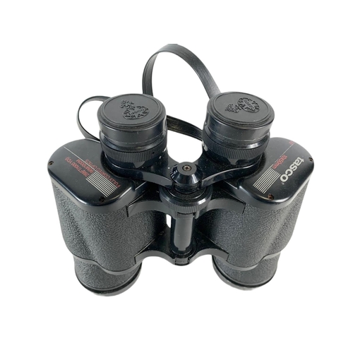 143 - Tasco binoculars in case. 20cm