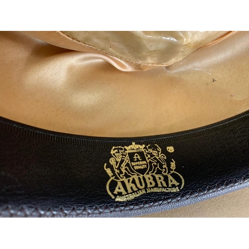 182 - Leather horse saddle and an Akubra hat.