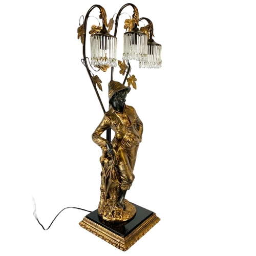 202 - Large ornate gilded lamp figure. 90cm