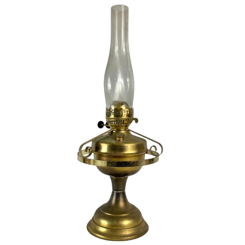 217 - 2 vintage brass oil lamps. 1 electrified. 61cm. 52cm