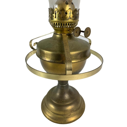 217 - 2 vintage brass oil lamps. 1 electrified. 61cm. 52cm