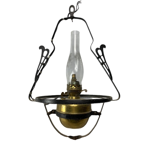 217 - 2 vintage brass oil lamps. 1 electrified. 61cm. 52cm