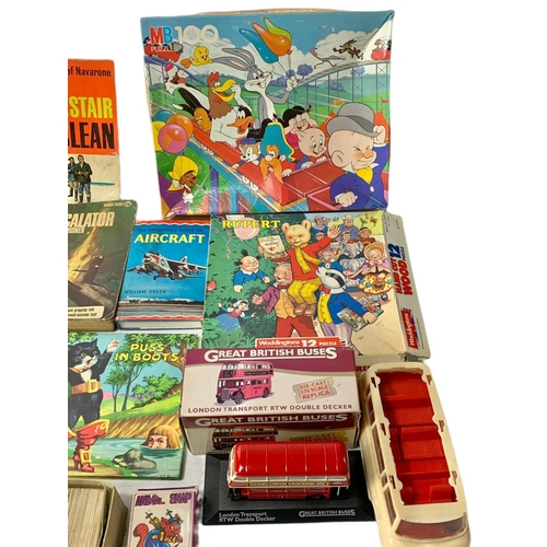 218 - Quantity of vintage books and games.