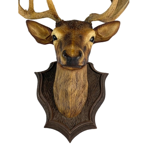 243 - Modern mounted stag head. Plastic. 44/60cm