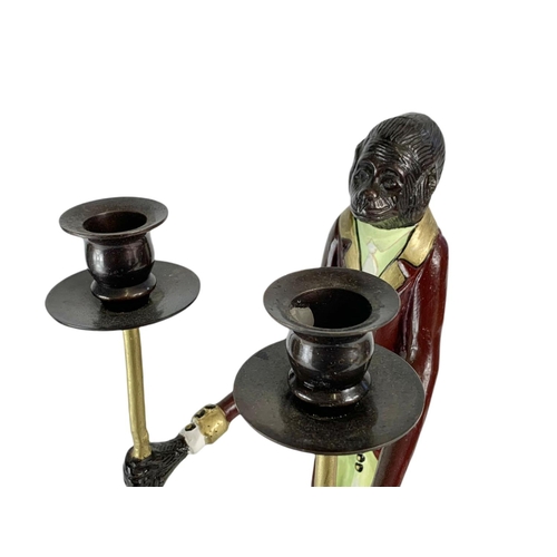 247 - Pair of tall Bronze monkey candlesticks. 41cm.