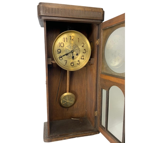 257 - 1930’s oak case wall clock. 74cm