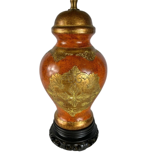 269 - Ornate Chinese style lamp on a carved wooden base. 71cm including shade.