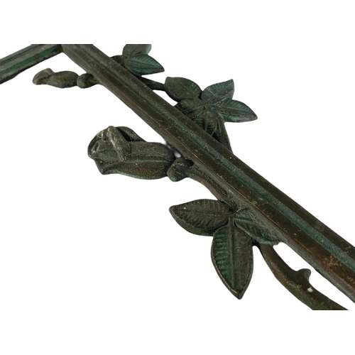 279 - 19th century bronze cross with flower decoration. 39.5cm