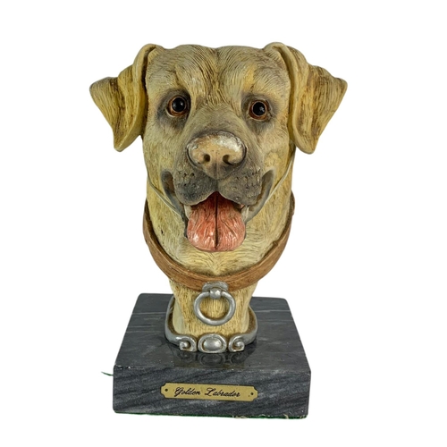 473 - Bust of a dog on a marble base. 12/18/23cm