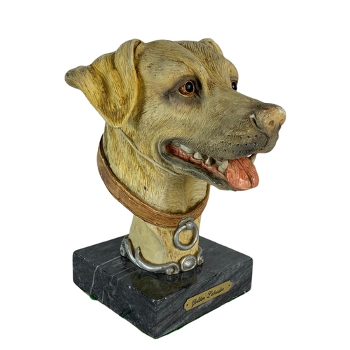 473 - Bust of a dog on a marble base. 12/18/23cm