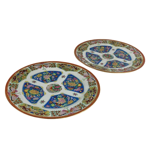 479 - Pair of vintage oriental pottery plates. 25.5cm.