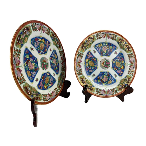 479 - Pair of vintage oriental pottery plates. 25.5cm.