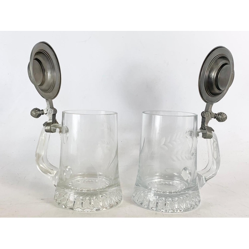 483 - Pair of glass beer steins. 16cm