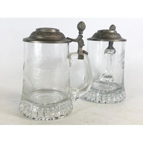 483 - Pair of glass beer steins. 16cm