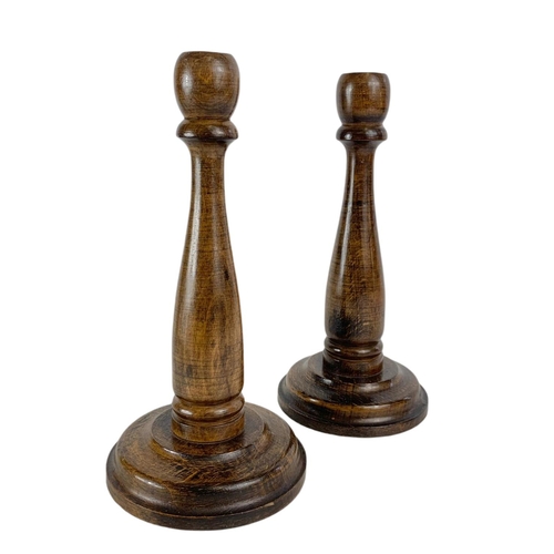 484 - Pair of vintage wooden candlesticks and a pair of brass ducks. 24cm