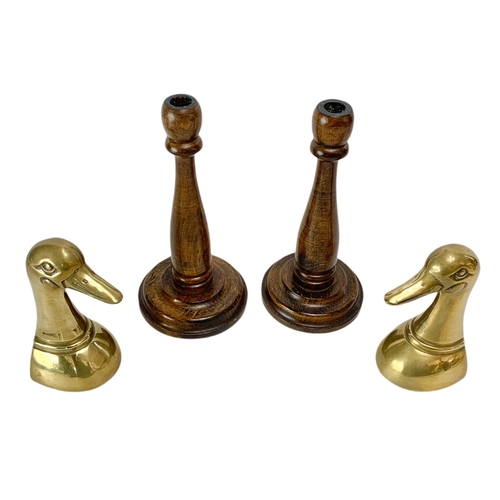 484 - Pair of vintage wooden candlesticks and a pair of brass ducks. 24cm