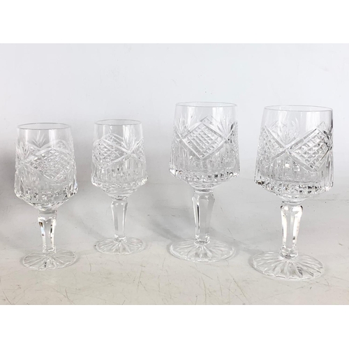 524 - Tyrone Crystal glasses and a pair of candlesticks