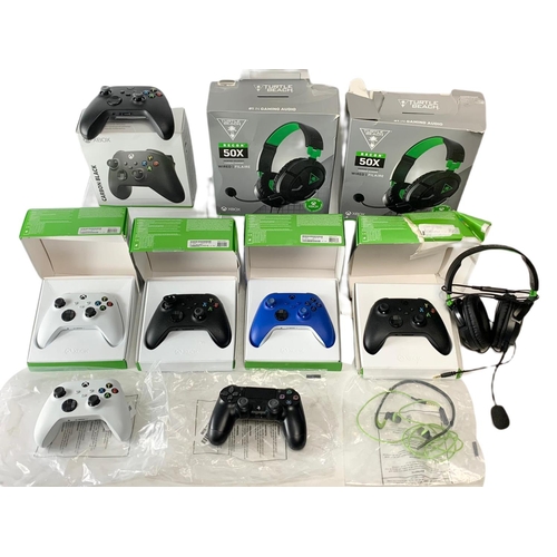 55 - 11 controllers and headphones for XBOX and PlayStation. 3 XBOX headphones, 7 XBOX controllers and a ... 