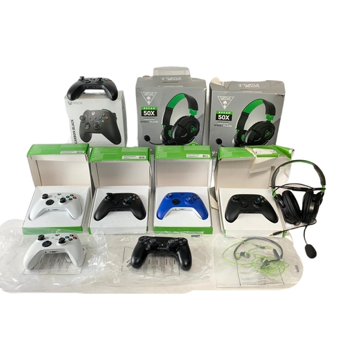 55 - 11 controllers and headphones for XBOX and PlayStation. 3 XBOX headphones, 7 XBOX controllers and a ... 