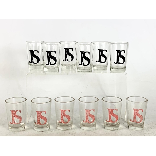 559 - 12 whisky shot glasses.