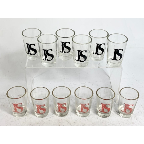 559 - 12 whisky shot glasses.