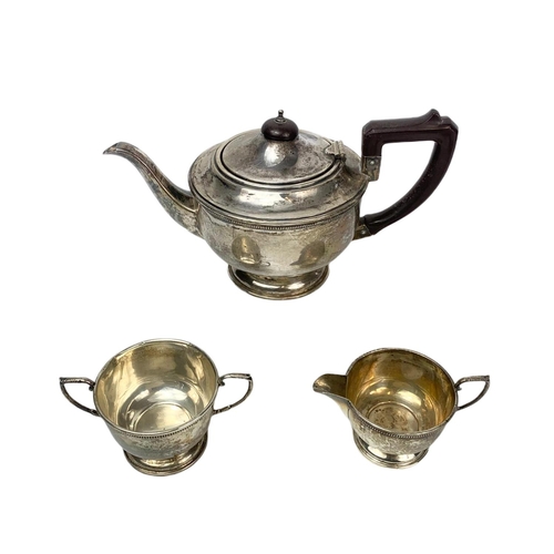 654 - Sterling silver early 20th century 3 piece tea service. 619 grams total.