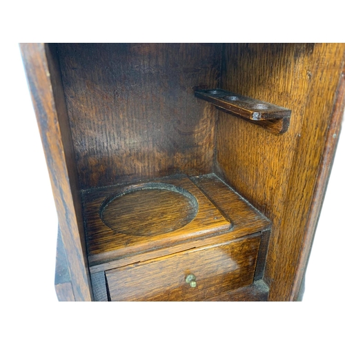 67 - 1920’s oak smokers cabinet. With pottery humidor. 20.5/16/28cm