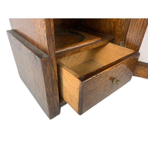 67 - 1920’s oak smokers cabinet. With pottery humidor. 20.5/16/28cm