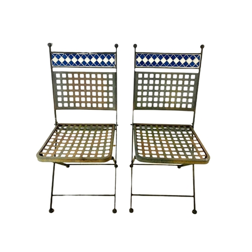 797 - Wrought iron garden table and 2 chairs. 90/72cm