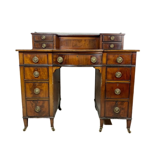 826 - Edwardian leather top desk in the Sheraton style. 102/56/94cm