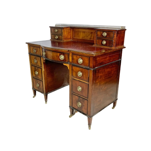 826 - Edwardian leather top desk in the Sheraton style. 102/56/94cm