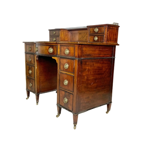 826 - Edwardian leather top desk in the Sheraton style. 102/56/94cm