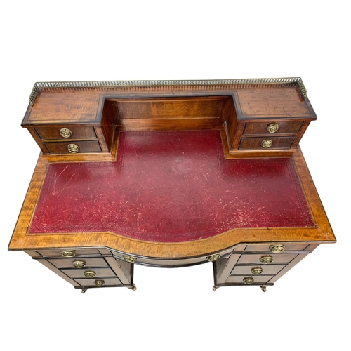 826 - Edwardian leather top desk in the Sheraton style. 102/56/94cm