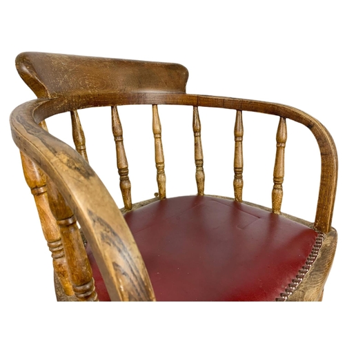 829 - Edwardian oak desk chair.