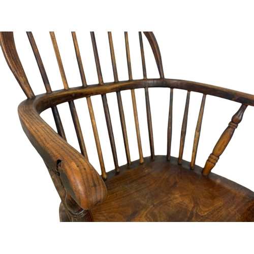 852 - Mid 19th century Windsor armchair. 93cm