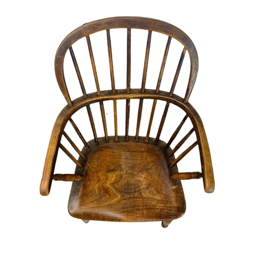 852 - Mid 19th century Windsor armchair. 93cm