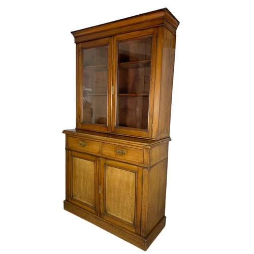 862 - Victorian blonde mahogany 2 door bookcase. 106/44/193cm