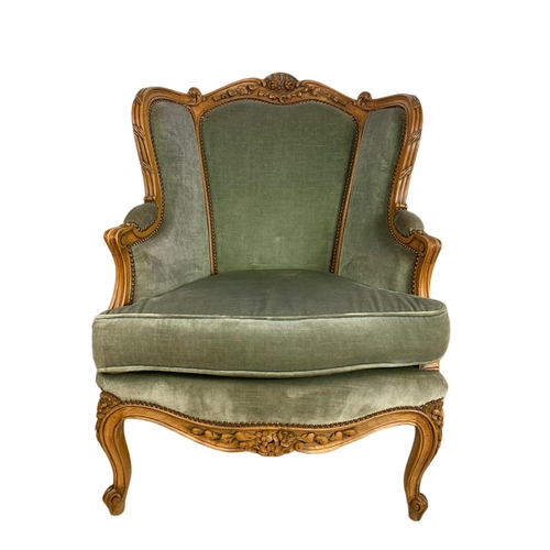 875 - Pair of early 20th century French carved walnut wingback armchairs. 70/75/101cm