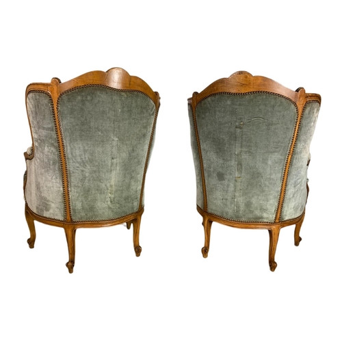 875 - Pair of early 20th century French carved walnut wingback armchairs. 70/75/101cm