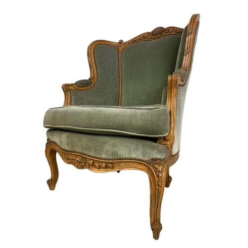 875 - Pair of early 20th century French carved walnut wingback armchairs. 70/75/101cm