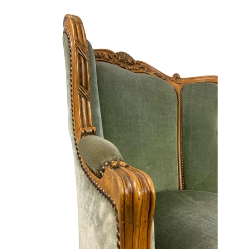 875 - Pair of early 20th century French carved walnut wingback armchairs. 70/75/101cm