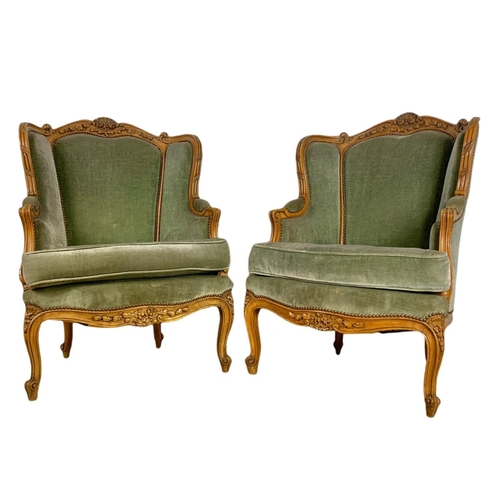 875 - Pair of early 20th century French carved walnut wingback armchairs. 70/75/101cm