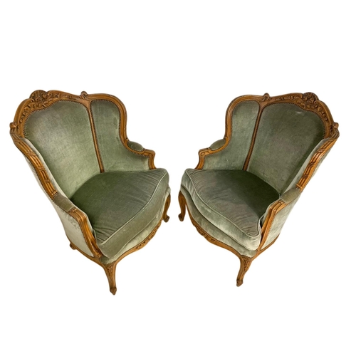 875 - Pair of early 20th century French carved walnut wingback armchairs. 70/75/101cm