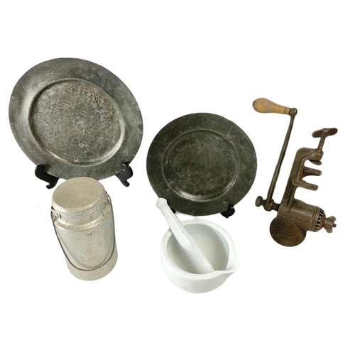 95 - Lot of old kitchenware. Including a pair of 19th century pewter plates, early 20th century mincer, a... 