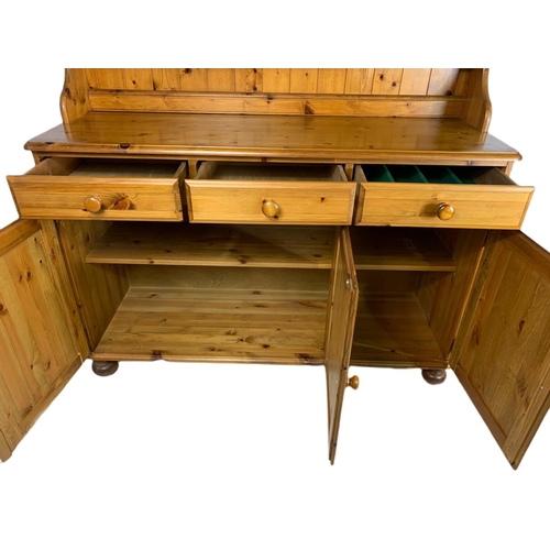 805 - Pine kitchen dresser. 132/45/190cm