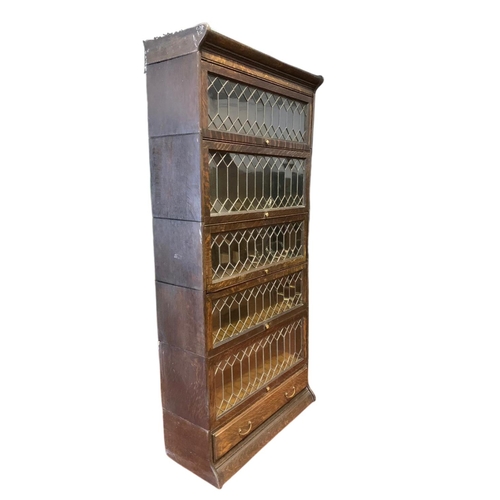 877 - Large Edwardian stacking bookcase with drawer by Gumm. 86.5/36/188cm